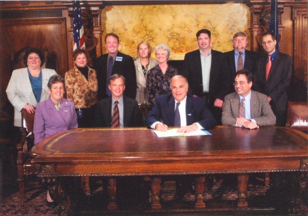 Pennsylvania Governor Ed Rendell signs Growing Greener 2 into law in 2005, supported by state conservation leaders, including John Hanger (PennFuture), Andrew McElwaine (PA Environmental Council), Josh First, Melody Zullinger (PA Federation of Sportsmen's Clubs), Andy Loza (PA Land Trust Assoc.), Jeff Schmidt (Sierra Club), Jan Jarrett (PennFuture), Julie Lalo (10,000 Friends of PA), and Steve Rogness (PennEnvironment).